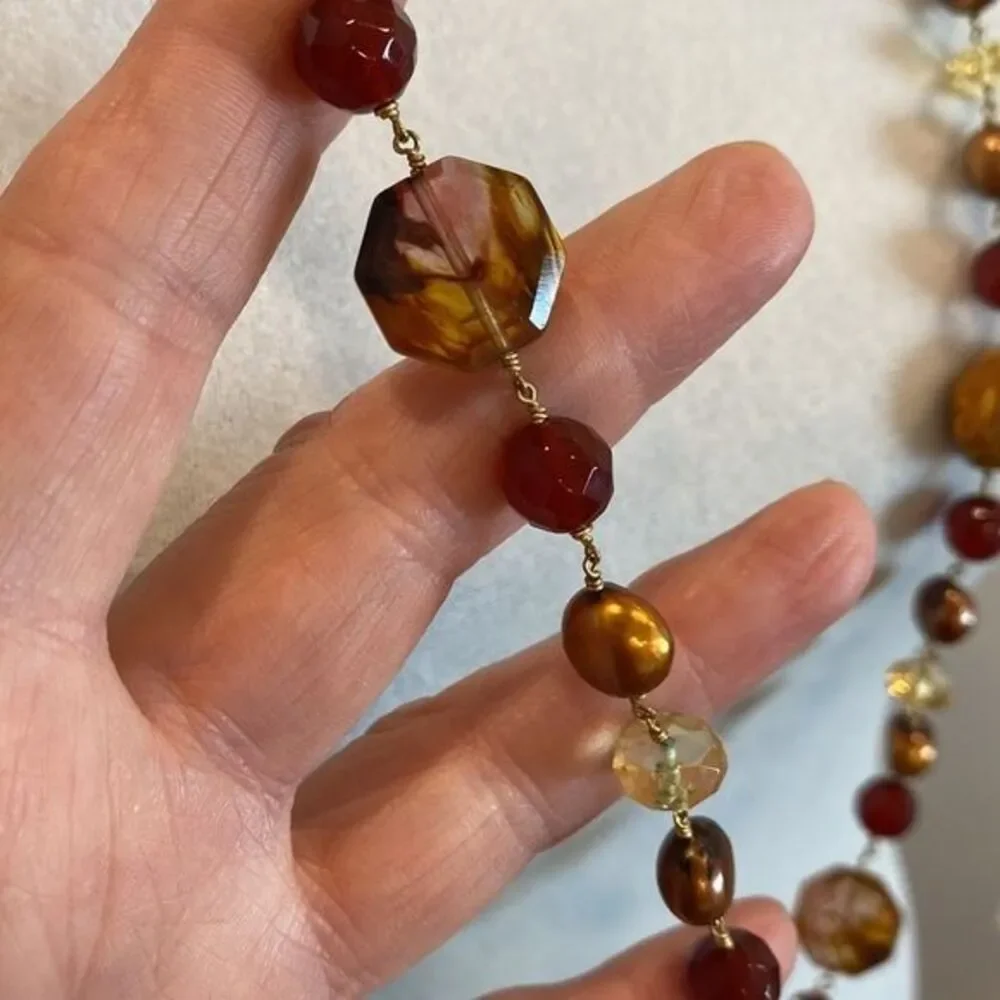 Double strand necklace Unique blend of beads and pearls. Toggle closure